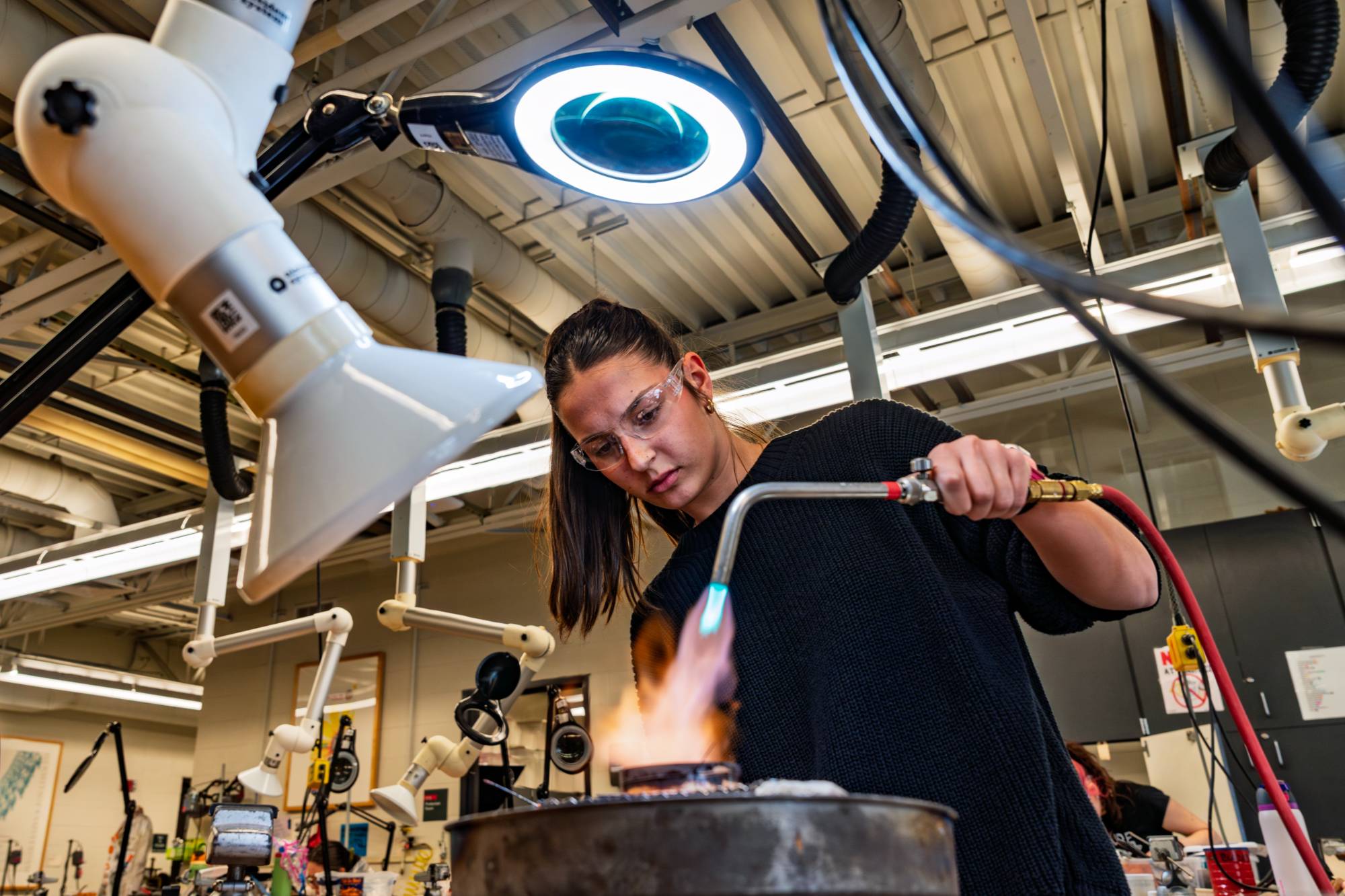 Student working with metal in the Jewelry studio